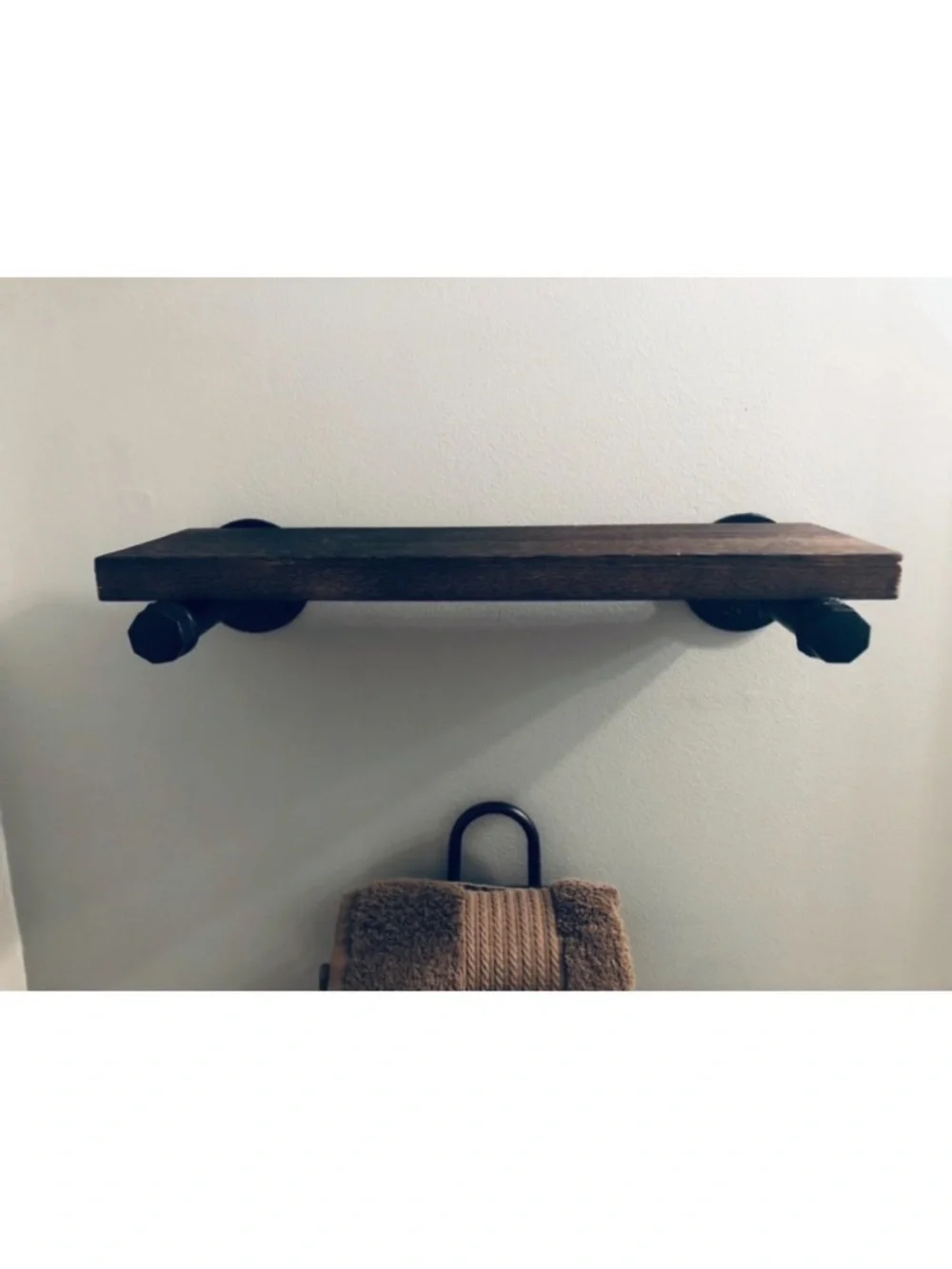 Two Rustic Dark Brown Wall Shelves with Black Pipe Brackets.